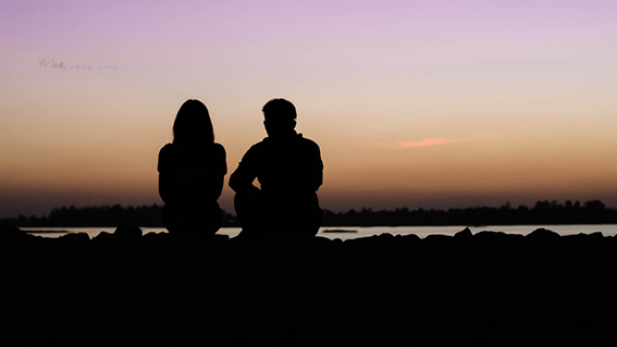 a beautiful sunset on the river and A happy couple in love